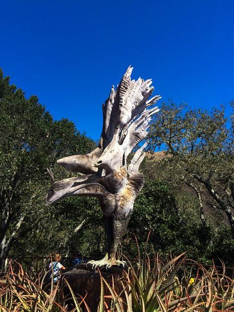 A wood sculpture in shape of a bird